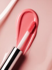 Obraz premium Close-up of pink lip gloss with applicator on a pastel background studio shot