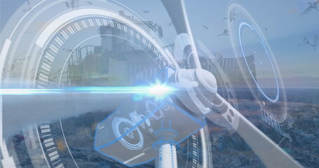 Image of windmill spinning with circular interface over bulldozer unloading junk at landfill