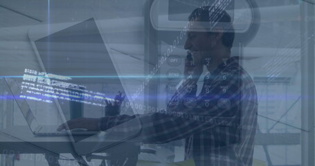 Typing man working on laptop at raised desk in office with binary code overlay, copy space