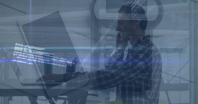 Typing man working on laptop at raised desk in office with binary code overlay, copy space