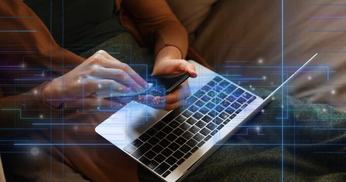 Image of empty interface screens and data processing over woman with laptop cleaning smartphone