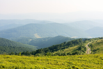 beautiful view of mountain landscape in summer. green hill rolling in to the distance in evening light