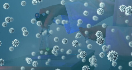 Image of virus cells over caucasian doctor in lab