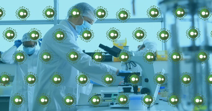 Image of virus cells over diverse doctors