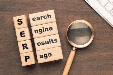 Conceptual image of SERP (Search Engine Results Page) represented by wooden blocks with text,...