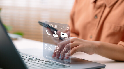 Customer using laptop and smartphone with virtual Contact Us interface, representing online...