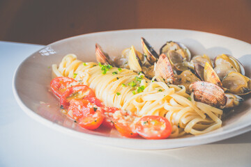 Miso Butter Vongole made with Clams, miso butter, tomatoes, linguine