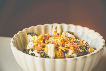 Burnt Brussels Sprouts with Char, Cream, and Umami Honey miso glaze, sour cream, fried shallots, chives
