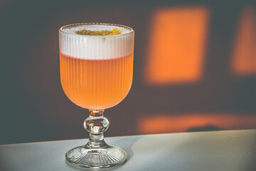A Coconut Campari cocktail made with
Campari, gin, coconut, lemon