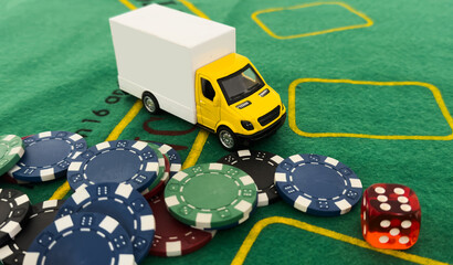 a toy truck with a poker chip 