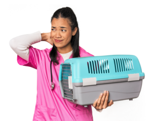 Young Filipina vet holding pet carrier touching back of head, thinking and making a choice.