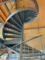 Open metal spiral staircase seen from bottom to top in bright sunlight, Oostvaardersplassen, Lelystad, Flevoland, Netherlands, June 07, 2025