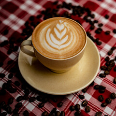coffee latte with coffee beans in the background