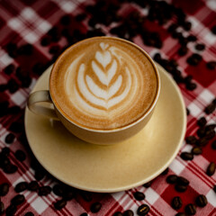 coffee latte with coffee beans in the background