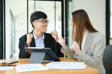 Young business entrepreneurs celebrating a success