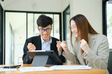 Young business entrepreneurs celebrating a success