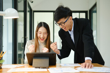 Young business entrepreneurs celebrating a success