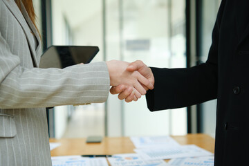 Partnership, teamwork and shaking hands for agreement, consulting or introduction in meeting