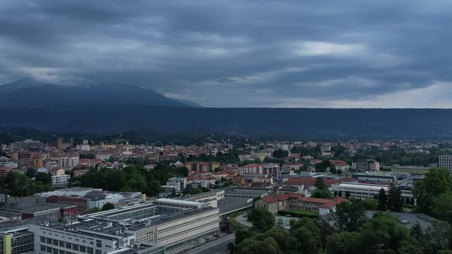 Drone view of the Nuovo Palazzo Uffici Olivetti by architect Gino Valle in Ivrea, Italy, hallmark of modernist corporate architecture now used by TIM, framed by green lawns, drone, slow motion.