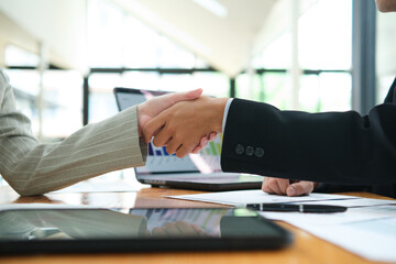 Partnership, teamwork and shaking hands for agreement, consulting or introduction in meeting