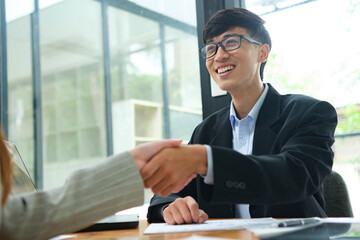 Partnership, teamwork and shaking hands for agreement, consulting or introduction in meeting