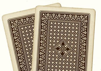 Obraz premium Close up of a pair of vintage playing cards in sepia.