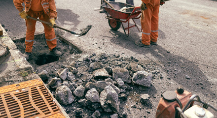 Construction worker working on a public city road reconstruction