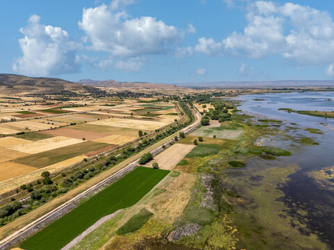 Isikli Lake meeting cultivated fields in Civril, Denizli, Turkey - Powered by Adobe
