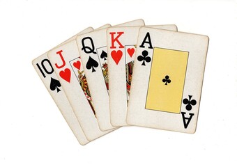 A poker hand of vintage playing cards isolated on a white background.