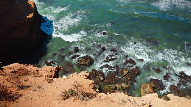 Closeup shot of the rocky coastline at Tamri sand dunes in Morocco. Arid natural desert landscape.