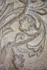 Obraz premium Floral stone carving, pattern marble background, ornate design, wall decor. Copy space