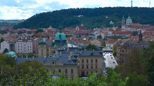 Prague cityscape with petrin hill and strahov monastery. Scenic view of prague's urban landscape, featuring the strahov monastery and petrin hill, showcasing a blend of historical architecture