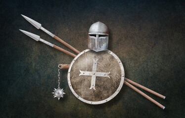 knight's helmet chain mace shield and two spears on grunge background