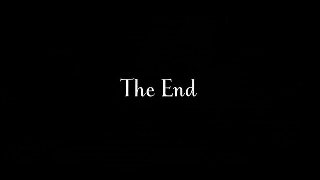 Cinematic text "The end"emerging on textured black surface, displaying dramatic conclusion through vintage typography, suitable for movie endings, presentations, video projects