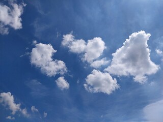 Puffy Clouds in Clear Sky