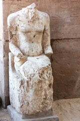 Damaged ancient statue in Luxor, Egypt. Karnak temple. Travel destination in North Africa..