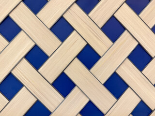 Close up of hand woven rattan texture in natural white beige and blue colors. Wicker and rattan art...