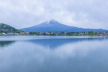Admiring the beautiful Mount Fuji at dusk over Lake Kawaguchi, Yamanashi Prefecture, Japan.