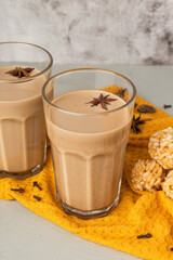 Cups of Indian masala chai on a metal try