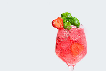 Glass of  strawberry and basil summer cocktail