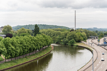 A Saar river runs through a forest and a highway in Saarbrucken Germany