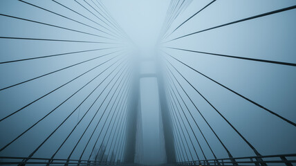 Foggy bridge suspension cables framed by misty towers, eerie beauty, cinematic look