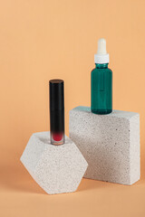 Mockup of black blank thin tube - mascara, lip gloss, gel, eyeliner, oil, etc. Cosmetic package with stylish props on cream background.