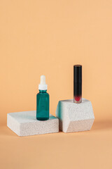 Mockup of black blank thin tube - mascara, lip gloss, gel, eyeliner, oil, etc. Cosmetic package with stylish props on cream background.