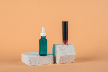 Mockup of black blank thin tube - mascara, lip gloss, gel, eyeliner, oil, etc. Cosmetic package with stylish props on cream background.