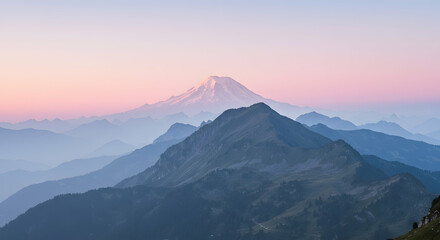 Layered Mountain Landscape at Dusk with Snowcapped Peak