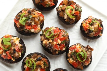 Delicious stuffed mushrooms on table, top view