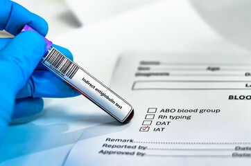 Blood sample tube and paper order request for indirect antiglobulin test analysis.