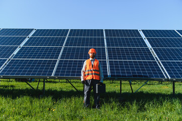 Worker installing solar panels for green energy