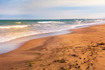 Sunset on sandy beach on the spit between Pomorie and Aheloy, Bulgaria